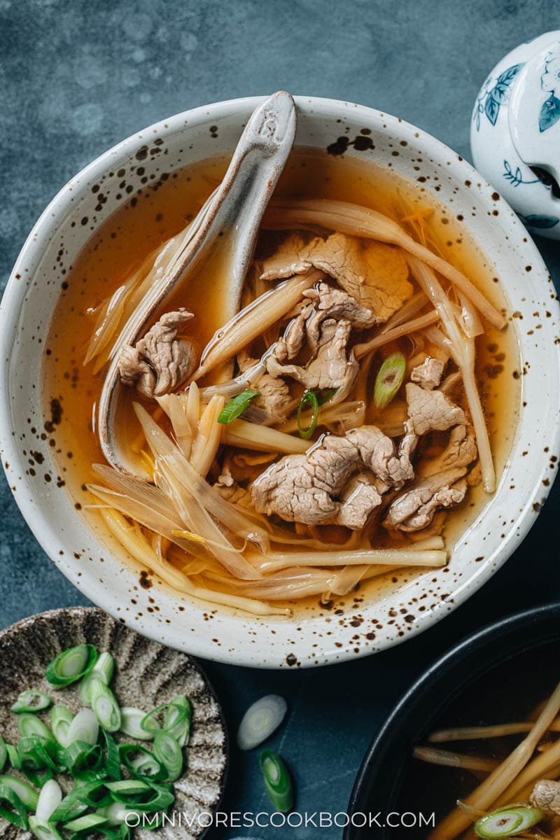 Sliced pork soup with lily flower in a bowl