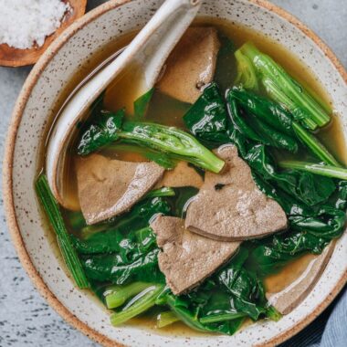 Pork liver soup with spinach close up