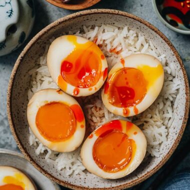 Chinese style marinated eggs over rice